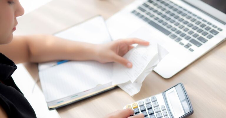 woman looking at collection receipt