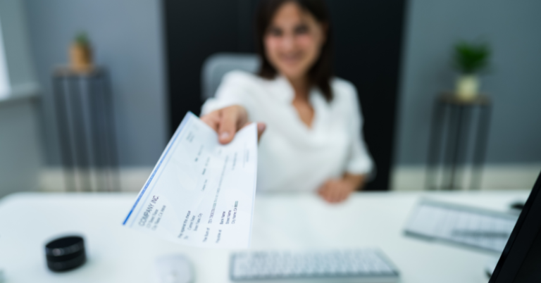 woman giving cash voucher sample