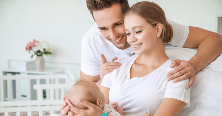 husband and wife with their newly born bay.