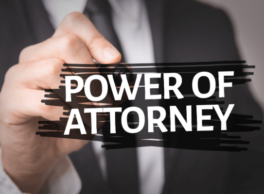 showing man as the background while touching the word power of attorney.